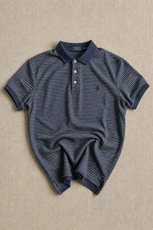 After: the same polo shirt as a clean studio-style flat lay on a linen backdrop