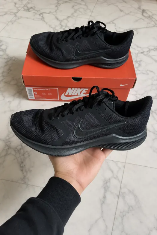 Nike trainers, photographed by Reframe on a marble background