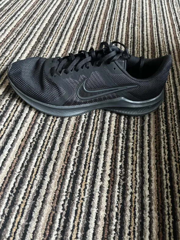 The original phone photo of the same nike trainers